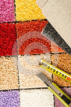 Carpet swatches, tape measure, boxcutter