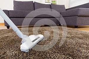 Carpet with vacuum cleaner in living room