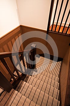 Carpeted U-shaped staircase in a luxury home