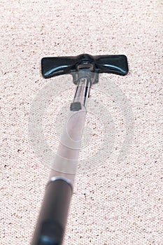 Carpeting cleaning with vacuum cleaner photo