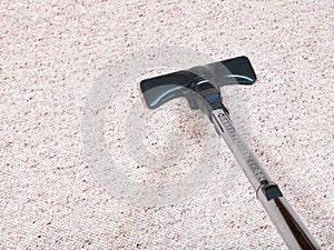 Carpeting vacuuming with vacuum cleaner photo