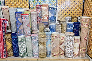 Carpets and kilims rolled up