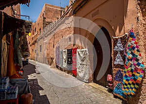 Carpets for sale hanging on the street of Marrakesh Medina, in Morocco