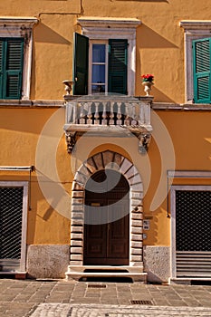 An ancient portal in the historical centre of Carrara photo