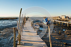 Carrasqueira Palafitic Pier in Comporta, Portugal with fishing boats