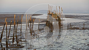 Carrasqueira Palafitic Pier in Comporta, Portugal at sunset