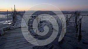 Carrasqueira Palafitic Pier in Comporta, Portugal at sunset