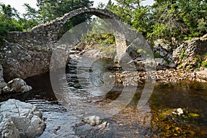 CARRBRIDGE, BADENOCH and STRATHSPEY/SCOTLAND - AUGUST 28 : Packhorse bridge at Carrbridge Scotland on August 28, 2015