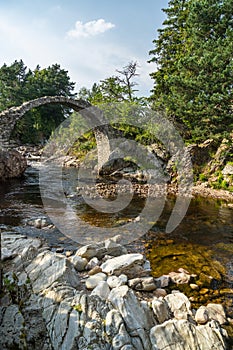 CARRBRIDGE, BADENOCH and STRATHSPEY/SCOTLAND - AUGUST 28 : Packhorse bridge at Carrbridge Scotland on August 28, 2015