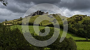 Carreg Cennen castle sits high on a hill near the River Cennen, in the village of Trap, four miles south of Llandeilo in