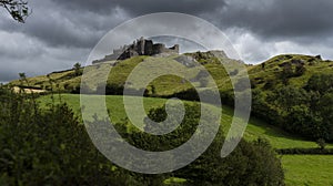 Carreg Cennen castle sits high on a hill near the River Cennen, in the village of Trap, four miles south of Llandeilo in photo