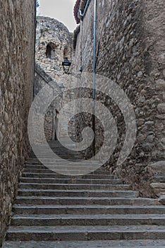 Old stair street between rock walls  at medieval town photo