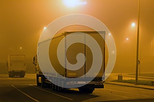 carriage of goods by road, trucking industry - overweight vehicle, foggy night road