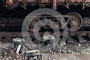 carriage wheel on railway tracks closeup. old iron transportation train on platform