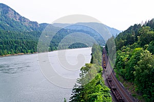 Carriages train railway along scenic wild Gorge Columbia River