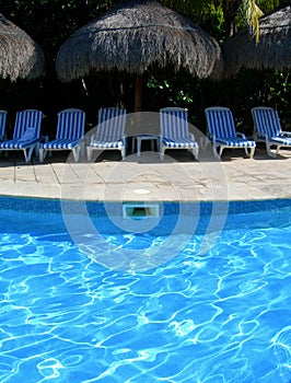 Carribean resort with poolside chairs