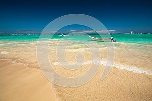 Carribean sea and boat on the shore, beautiful panoramic view