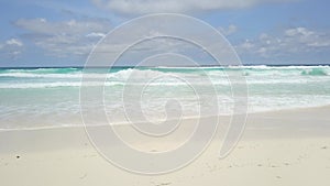 Carribean sea. Relaxing shot of waves washing the white sand beach in the carribean. White sand, clear water and