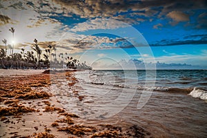 Carribean vacation, beautiful sunset over tropical beach in Punta Cana