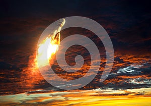 Carrier Rocket Takes Off On A Background Of Red Clouds