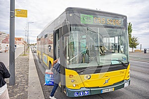 Carris public passenger bus number 735 heading to Cais de SodrÃ© stopped to pick up users