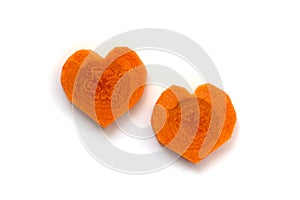 Carrot. 2 slices in heart shape isolated on white background. Difference versus similarity concept. Couple relationship concept