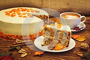 Carrot cake with cappuccino on wooden background