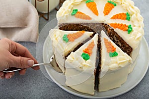Carrot cake with cream cheese frosting cut into slices