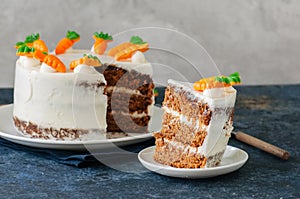 Carrot cake with cream cheese frosting decorated with carrot mar