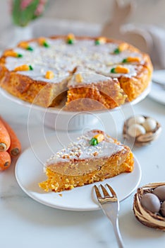 carrot cake pie sprinkled with nuts decorated with cream-colored carrots