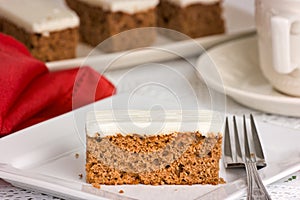 Carrot Cake on a white plate with fork. Shallow depth of field
