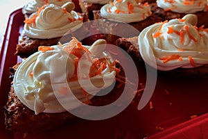 Carrot cakes decorated with whole almonds.