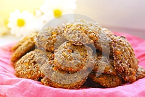 Carrot cookies on the cloth with chamomile