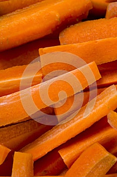 Carrot on cutting board preparated for cooking