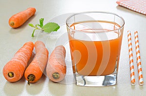 Carrot juice in a glass cup