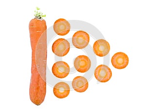 Carrot lying vertically next to carrot slices on a white isolated background