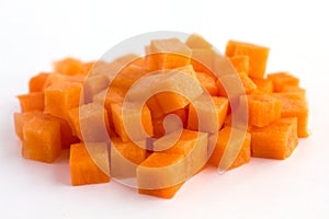 Carrot neatly chopped into cubes photo