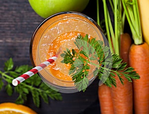 Carrot orange smoothie. Healthy lifestile. Green concept.