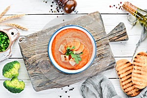 Carrot puree soup. with toast bread. Dietary food. Top view.