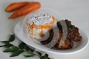 Carrot puttu with chicken roast prepared in Kerala style photo