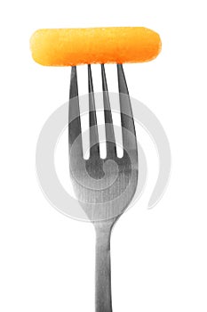 Carrot slice on fork isolated on white background