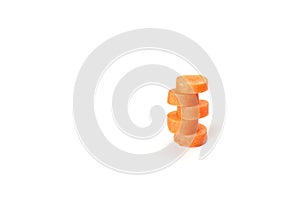 Carrot sliced into round slices isolated on white background