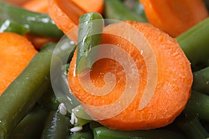 Carrot slices and chopped green beans macro.