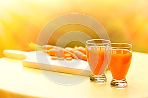 Carrot smoothie on table