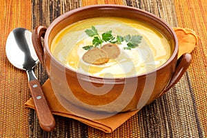 Carrot soup with croutons and parsley photo