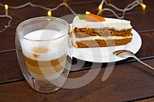 Carrot sponge cake with cream and walnuts and Cappuccino coffee