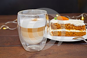 Carrot sponge cake with cream and walnuts and Cappuccino coffee