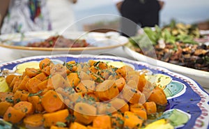 Carrots with herbs and butter or oil at an italian buffet photo