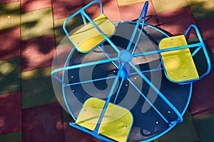 Carrousel for children in the public playground, top view