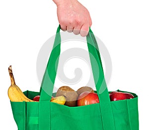 Carrying Groceries in Reusable Green Bag photo